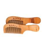 공장 직접 대형 나무 빗 마구간 제품 천연 건강 관리 복숭아 나무 빗 정전기 방지 건강 관리 복숭아 나무 빗의 그림