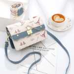 겨울 가방 여성용 2023 년 새로운 외국 스타일 여성 지구 여성 올해 인기있는 숄더백 크로스 바디 백 도매의 그림