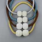 커튼 버클 자석 라이트 럭셔리 패션 거실 커튼 타이 백 타이 백 크리 에이 티브 두꺼운 로프 진주 커튼 마그네틱 버클 도매의 그림